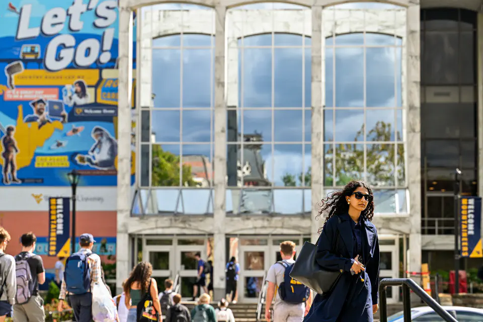 WVU students walk to and from the main entrance of the Mountainlair on the Downtown Morgantown campus.